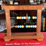 The Oriental Bead Rack (#2 of 3) by Louis Paul Productions, Joseph Ovette